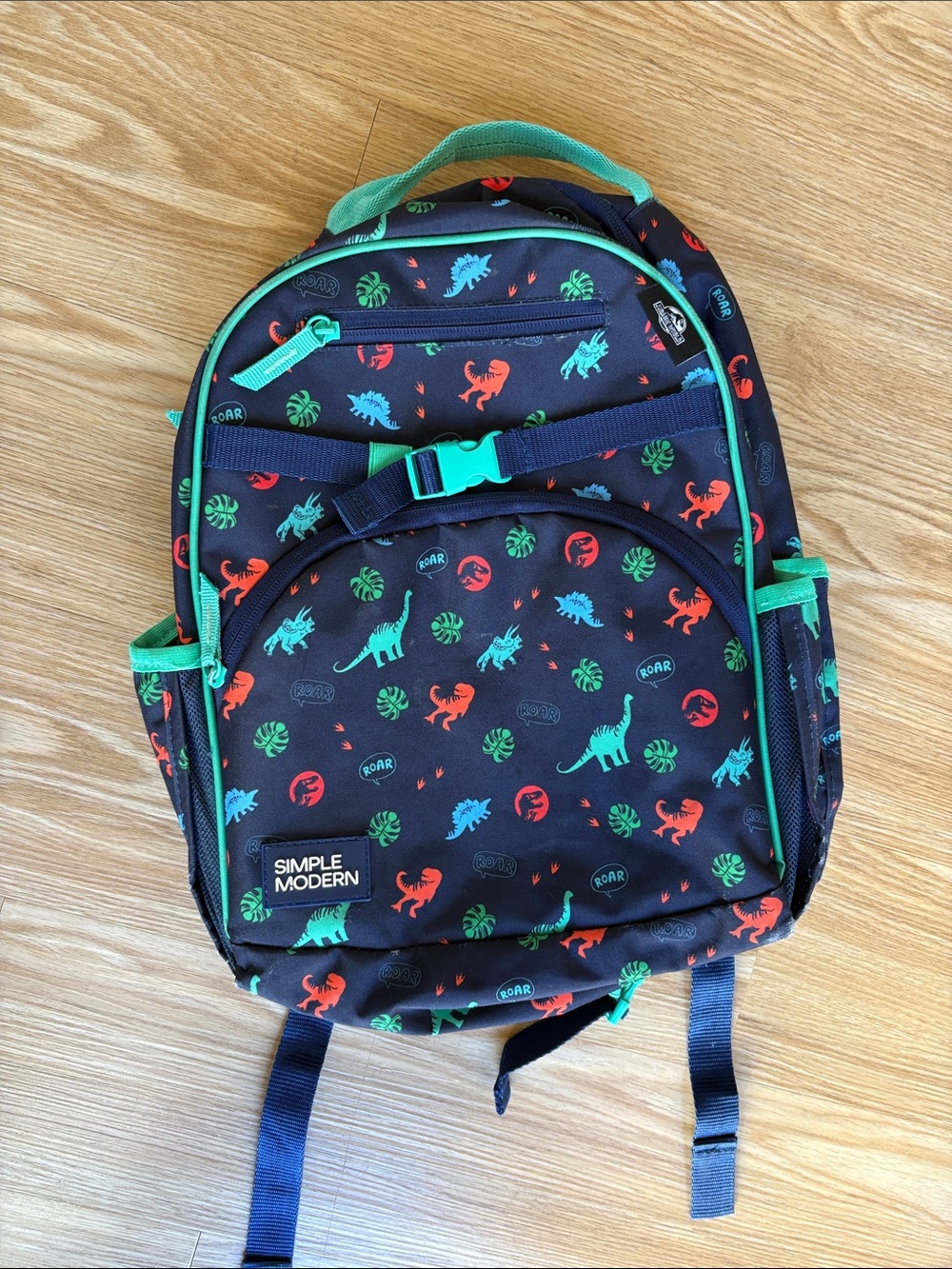 Simple Modern Kids' Dinosaur Backpack in Navy with Red and Teal Dinosaurs